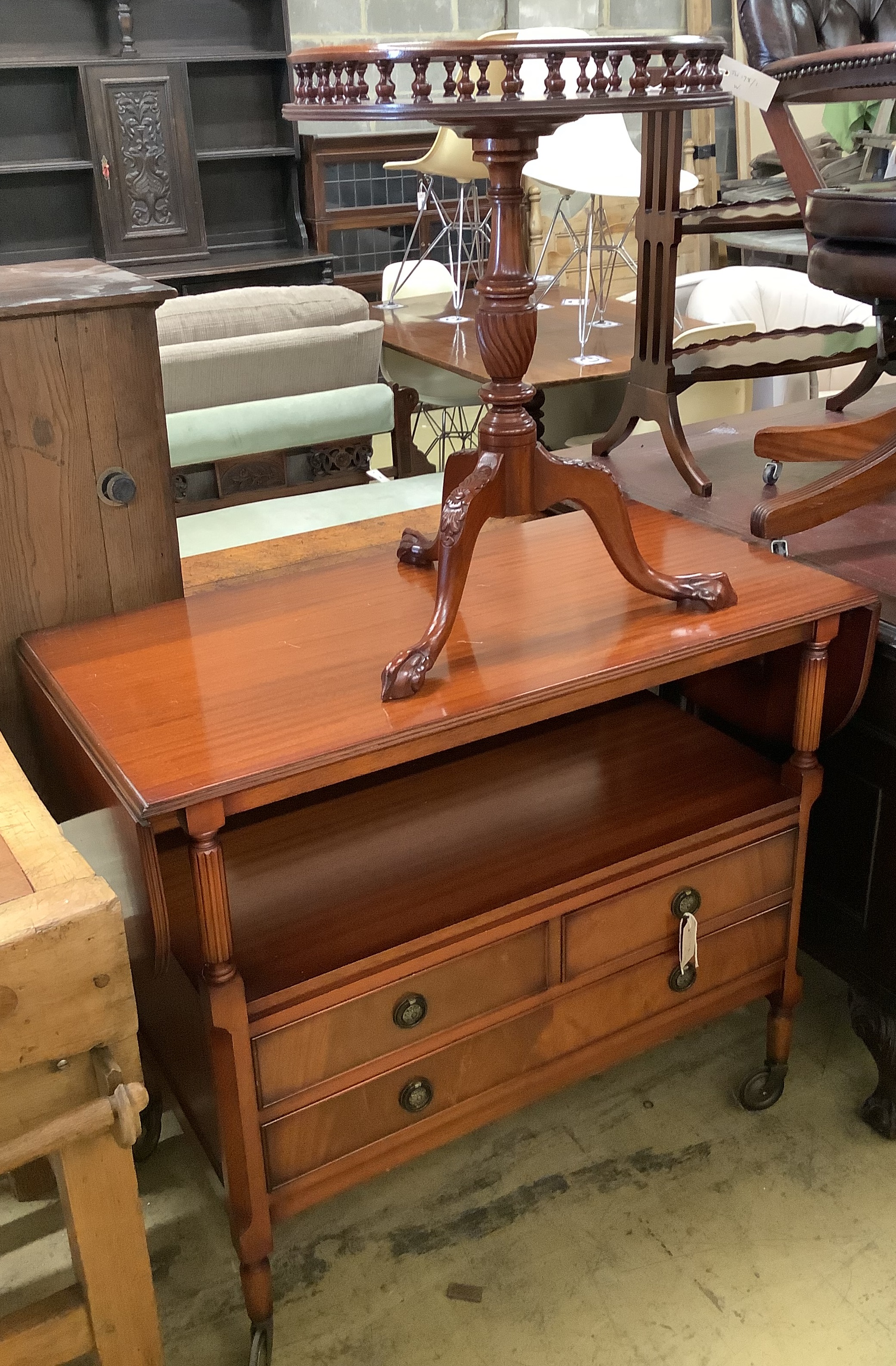 A circular occasional table with galleried top, diameter 48cm together with a drop-flap buffet table with raised top